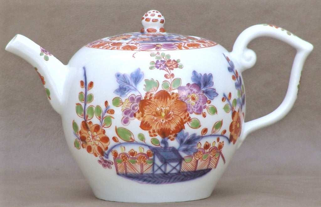 A sweet little set for two made in the Meissen factory. There is a slight variation in the marks, two of them with letters in addition to the crossed swords. The iron red painting is so fine that some of it must have been done with a single hair