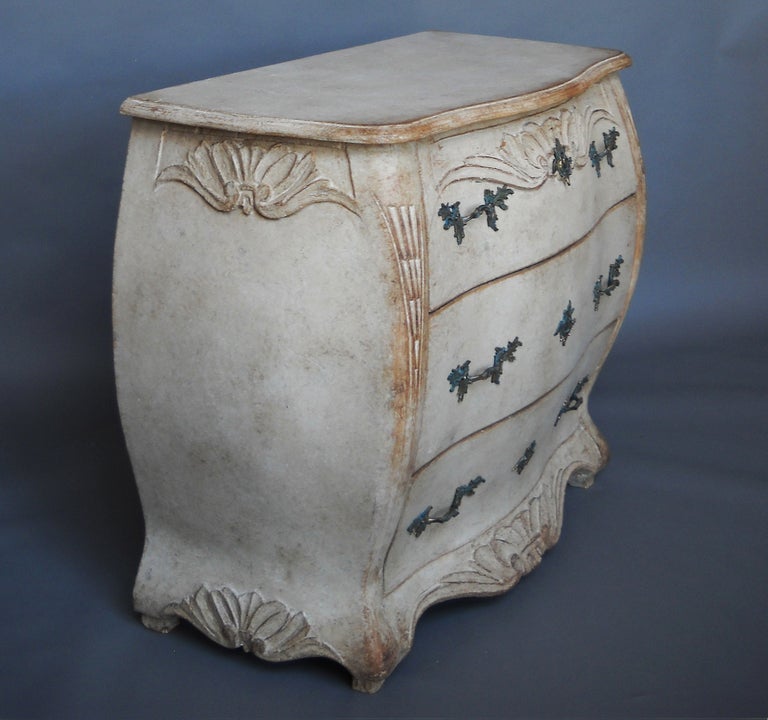 Chest of three drawers, Sweden circa 1860, with bombé form and carved detail. A beautiful piece.