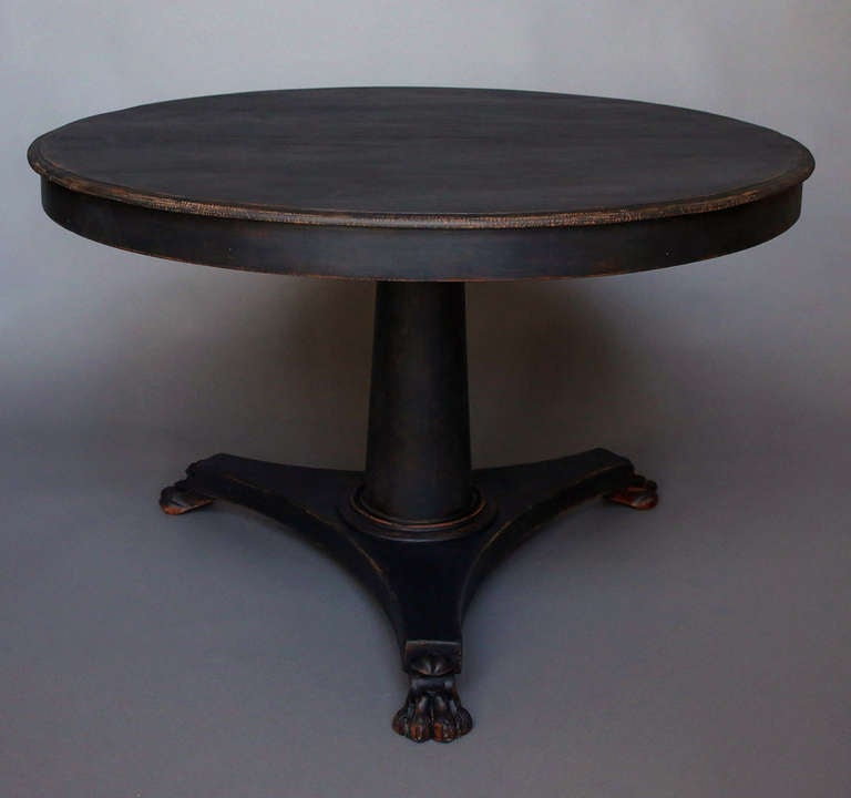 Swedish breakfast table, circa 1840, with a pedestal base and bold paw feet. Easily seats four.