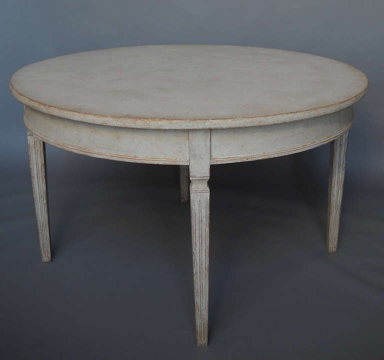 Swedish dining table seating four, circa 1880. Refined Gustavian style with fluted and tapering legs.

For detailed photos, see http://www.cupboardsandroses.com/items/1282.php