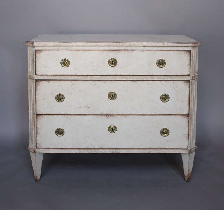 Gustavian chest of drawers, Sweden circa 1800, with fluting on the canted corners and a carved band under the top drawer. Beautifully detailed brass hardware.