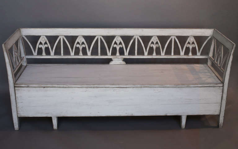 Gustavian open-backed bench, Sweden circa 1810, with open space under the lift out seat. Simple, classically Swedish form doing triple duty for seating, sleeping, and storage.