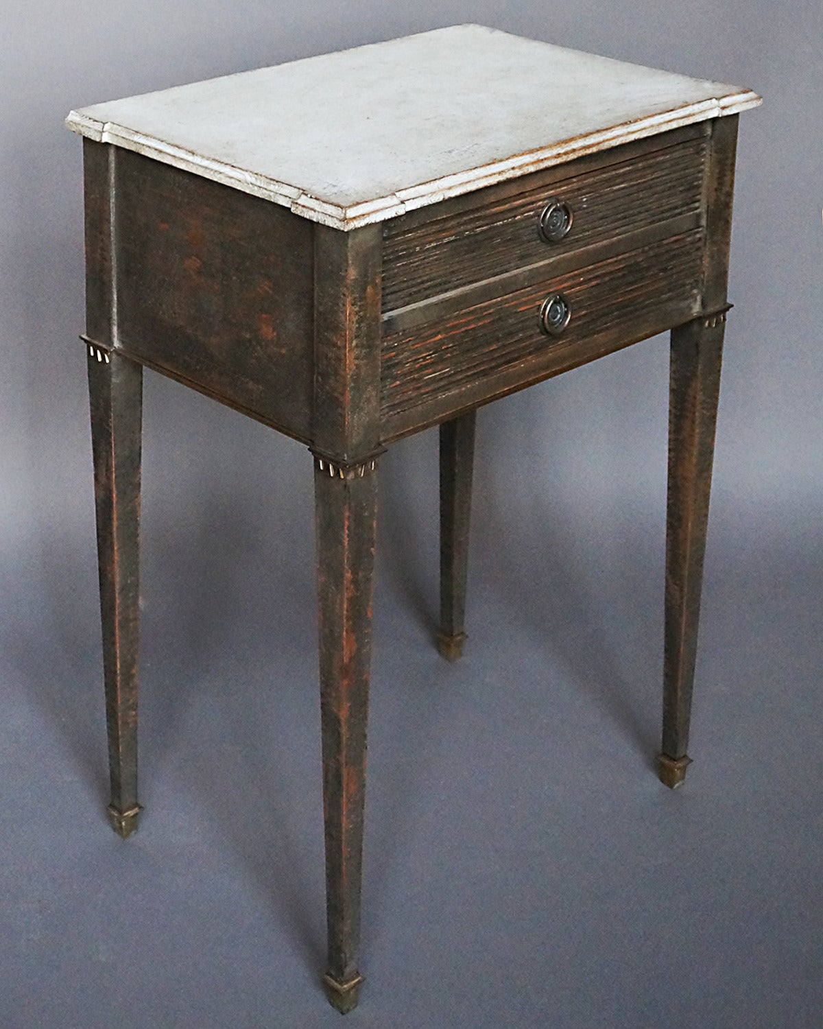 Two drawer work table, Sweden circa 1870, with shaped top, reeded drawers and brass details.