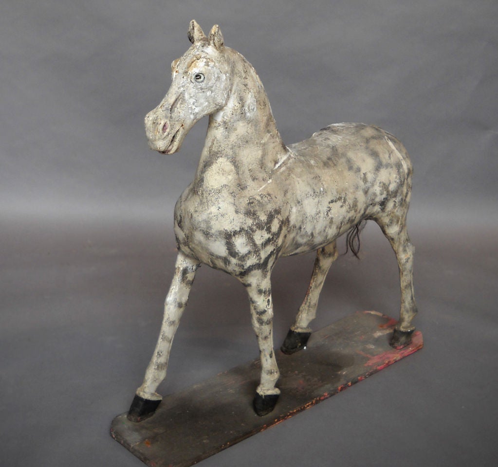 Large horse, circa 1820, with wooden frame and original painted surface from Rosenholm Castle in the north of Denmark. Original dapple gray paint and horsehair tail. Painted eyes with isinglass coverings. This horse was most probably a pull toy on