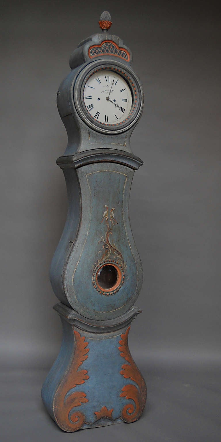 Beautifully painted Mora clock with a crown and finial by Sven Morin, Sweden circa 1820. Original clockworks with signed dial. A rare example in wonderful condition.
