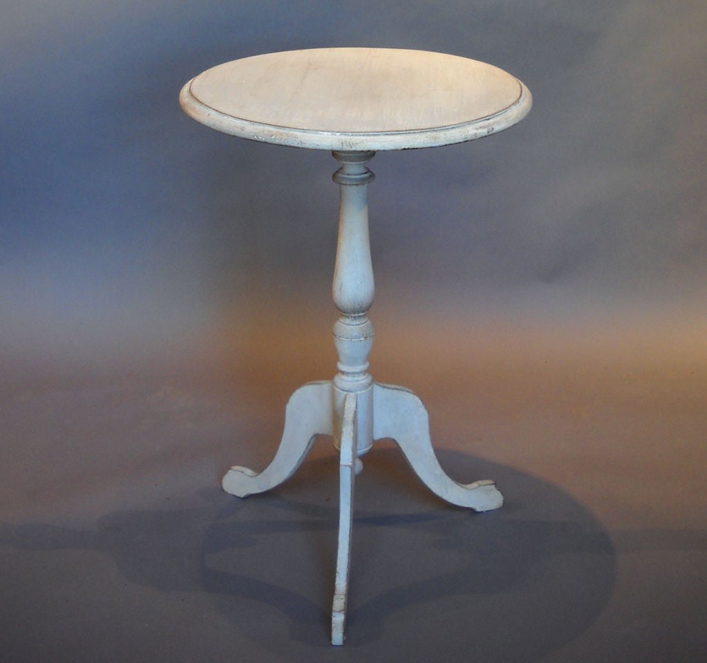 Simple round candlestand, Sweden circa 1890, with turned base and three legs.