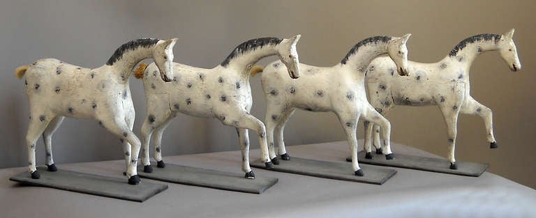 Four carved toy horses by Ewald Person of Malmø, Sweden, circa 1910. These were made for Person's grandchildren and are quite similar, perhaps in the hope that the children wouldn't fight over them. Still, each horse has its own personality. with