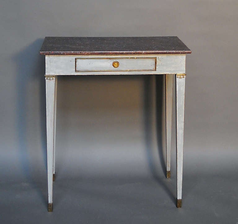 Swedish side table, circa 1910, in the Gustavian style. Bronze mounts, porphyry-painted top, and tapering square legs.