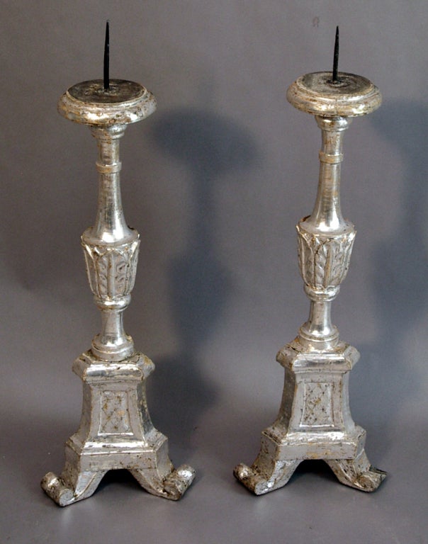Pair of altar candlesticks, Italy circa 1780, with silver leaf on the front sides, an interesting technique which provides the greatest effect for the least cost.