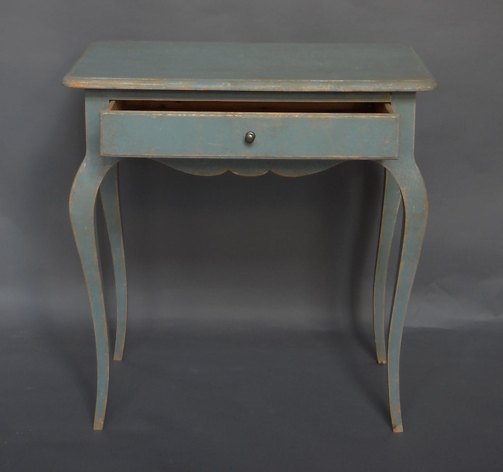 Blue painted rococo-style side table with single apron drawer, Sweden circa 1910. Shaped apron and graceful tapering cabriole legs.