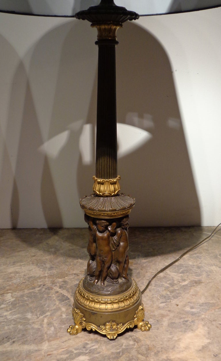 A Fine Pair of Louis Philippe Patinated & Gilt Bronze Candelsticks, now as Lamps