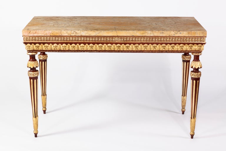 An Important Neoclassical 
Lacquered & Parcel Gilt Console
Florence, Italy 18th Century

The spetacular & wonderful sienna veneered marble top above the conforming frieze with carved guilloche and leaf tip decoration, raised on waisted circular