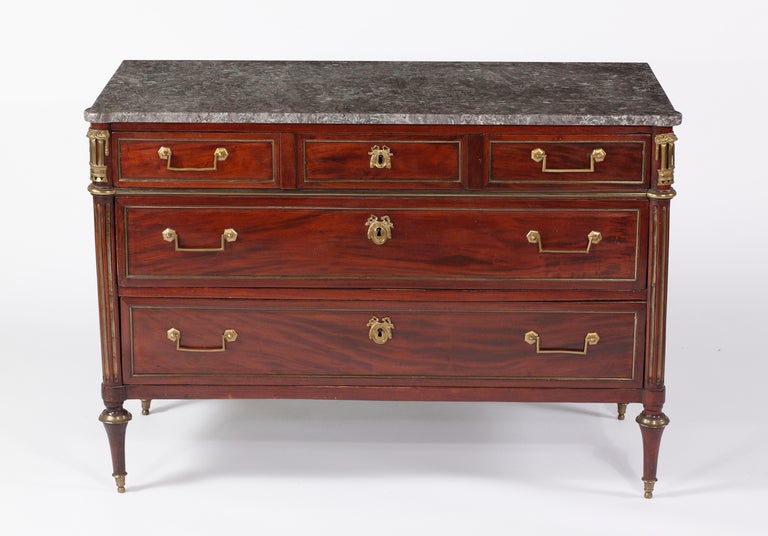 A Louis XVI Bronze Mounted 
Mahogany Commode
Circa 1790

The marble top above three long drawers and brass inlaid fluted pilasters, all on toupie feet

Height 35 in.  Width 50 in.  Depth 23 in.

Provenance: 
Property of a gentleman,L.A.,CA
Le