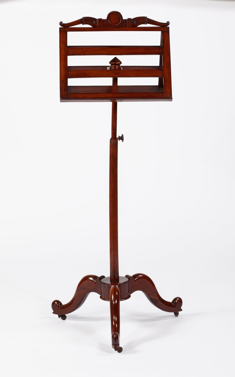 A Fine French Empire 
Mahogany Music Stand
19th Century

The adjustable top with swan carvings on the side with gilt bronze mounts over a tripod base ending in castors.

Height 58 in.  Width 20 in.  Depth 16 in.

Provenance:
Private