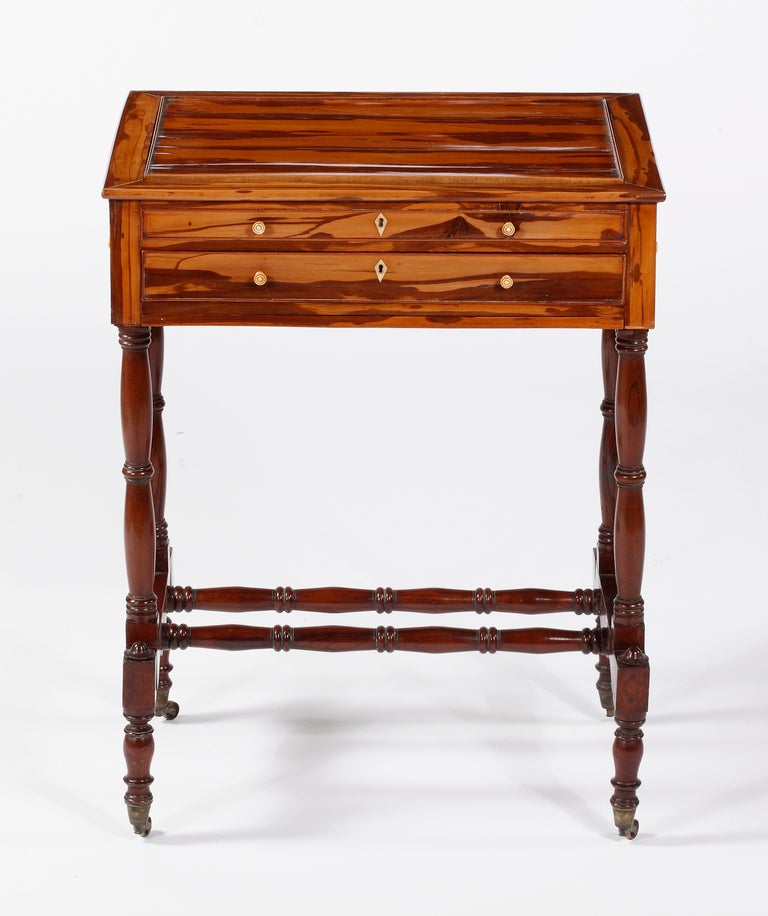 A Fine & Rare Regency
Calamander, Mahogany, & Satinwood
“Tric Trac” Table
Early 19th Century

The Calamander top revealing a game interior over a frieze with a single large drawer on front, with false drawers throughout all resting on a base