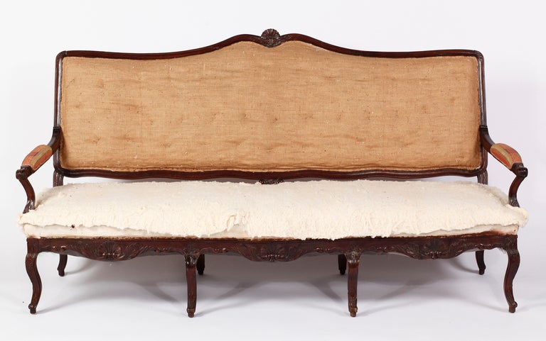 18th Century and Earlier A Regence Carved Stained Beechwood Canapé, 18th Century For Sale