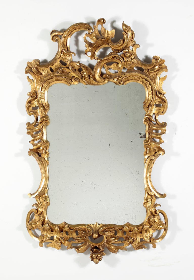 A George II Giltwood Mirror
18th Century

The vertical rectangular plate within the pierce carved foliate frame

Height 52 in.   Width 30 in.

Provenance:
Private Collection New York
Le Trianon Fine Art & Antiques

Mir 42
