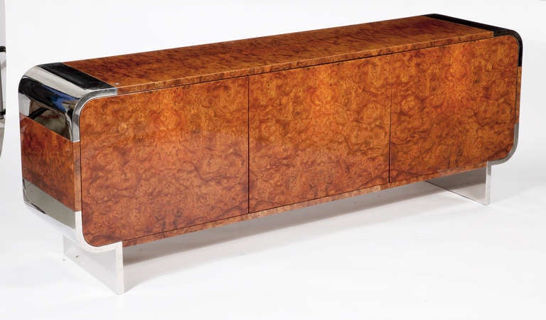 A Fine Burl Walnut and Chrome 
Cabinet by The Pace Collection 
Circa 1970â??s

With rounded Chrome corners, 
with three hinged doors to conceal adjustable shelves 
and drawer compartments.
 
Labeled on interior of right door

Height 31 in.