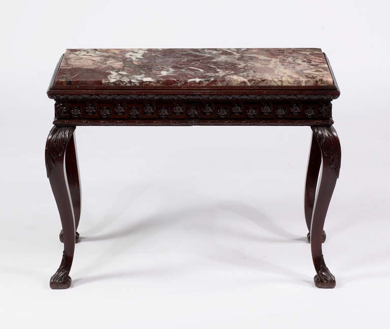A Fine Irish Mahogany Marble Top Console Table
18th Century

With a rectangular marble insert over a finely carved frieze, 
all resting on cabriole legs ending in pad feet.

Height 29 in.  Width 38 in.  Depth 19 in.
reduced in size
