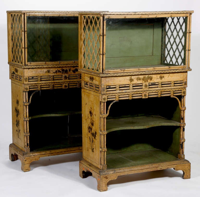 A Pair of Regency Cream, Black and Gilt-Japanned
Display Cabinets
Late 18th Century/Early 19th Century

Provenace; Doris Duke Collection

Each with a rectangular top above a glazed fall front door and lattice 
pierced sides over a clusteredcolumn