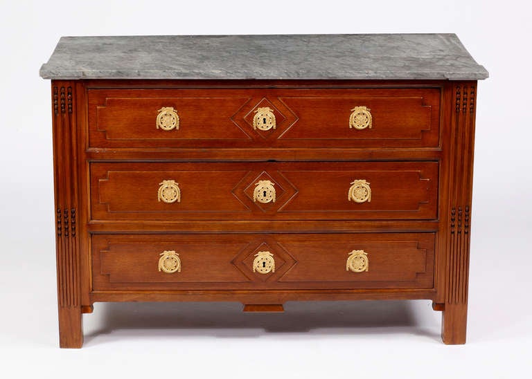 A Fine Louis XVI Parisian 
Mahogany Marble Top Commode
18th Century

The molded rectangular grey marble top above three drawers 
with bronze handles and escutcheons ,on square legs

Height 35 ½ in.    Width 52 ½ in.   Depth 25 in.

Remarks; one of