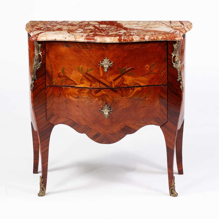 A Fine Louis XV Kingwood & Tulipwood 
Marquetry Ormolu Mounted Two drawer
Commode with a Musical Design Inalid
18th Century
Stamped Boudin
Leonard Boudin Maitre 1761

Height 32 in.  Width 34 in.  Depth 16 in.

Reference:  Dictionnaire des