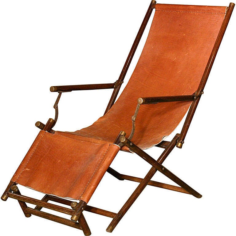 A Brass-Mounted Rosewood Campaign Armchair
Signed and Dated 1909
The turned collapsible frame with leather seat and footrest, the back stretcher with a plaque inscribed P.H.V.K./D.7.5.1909