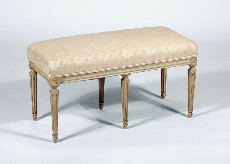 A Louis XVI Painted Bench
18th Century
In the manor of George Jacob

Height 18 in.  Width 36 in.  Depth 16 in.
 
With six tapering fluted legs 

Georges Jacob (Cheny, Burgundy, 6 July 1739 — 1814, master 1765) was one of the two most