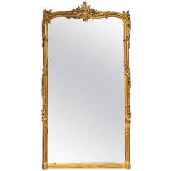 A Louis XV/XVI Transitional Giltwood Mirror, 18th Century