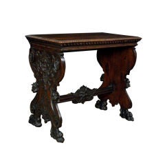 An Italian Baroque Style Carved Walnut Occasional Table