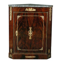 A French Empire Mahogany Corner Cabinet with Ormolu Mounts