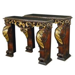 An Unusual Pair of Baroque Carved & Parcel Gilt Consoles