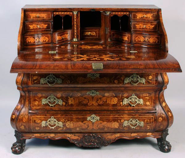 Top lid, sides and front inlaid with flowers, urns of flowers and trailing vines. Three drawers with slant lid which opens to reveal a wonderful interior including nine drawers and two pigeon holes. Many secret compartments inside.  Lid and interior