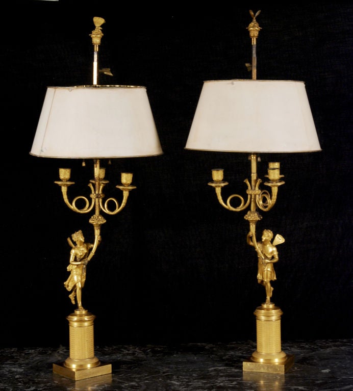 A Fine Pair of Neoclassical 
Bronze Dore Candelabra
With the Mythological Figures  of Flora & Zephyr
Now mounted as Bouillotte Lamps
Early 19th Century
Attributed to Thomire a Paris, 1751-1843

In Roman mythology, Flora was a goddess of