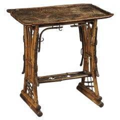 Table Art Nouveau en bois de feuillus sculpté et bambou