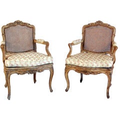 A Pair Of Louis Xv Green-painted And Caned Fauteuils