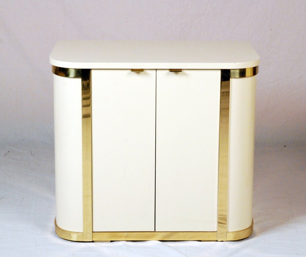 American A Pair White Lacquered & Brass Cabinets by John Stuart For Sale