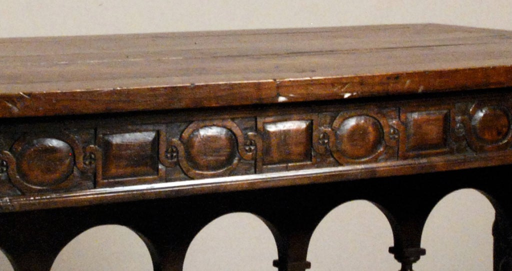 The rectangular top over a frieze, 
all resting on a joint stretcher base