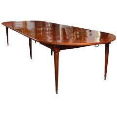 A Louis XVI Faded Mahogany Round Extending Dining Table