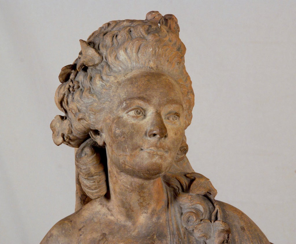 A Terracotta Bust of a Lady on a round marble base
French, 18th century
Attributed to Jean-Antoine Houdon
Illegibly Stamped

Jean-Antoine Houdon  (20 March 1741 – 15 July 1828) was a French neoclassical sculptor. Houdon is famous for his