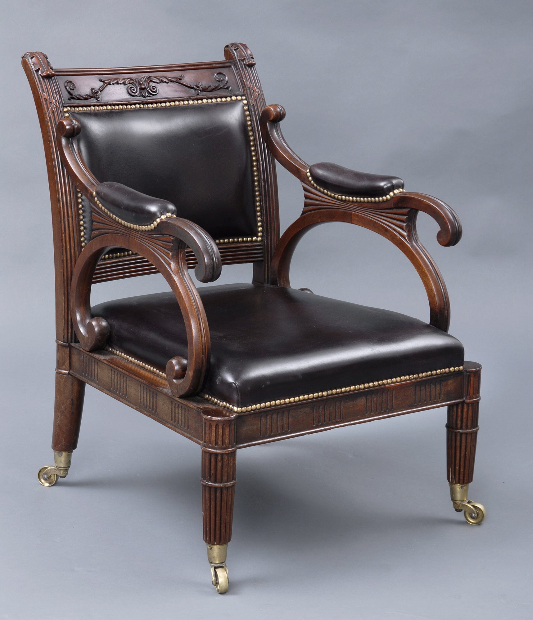 English Regency Carved Mahogany and Leather Library Armchair For Sale