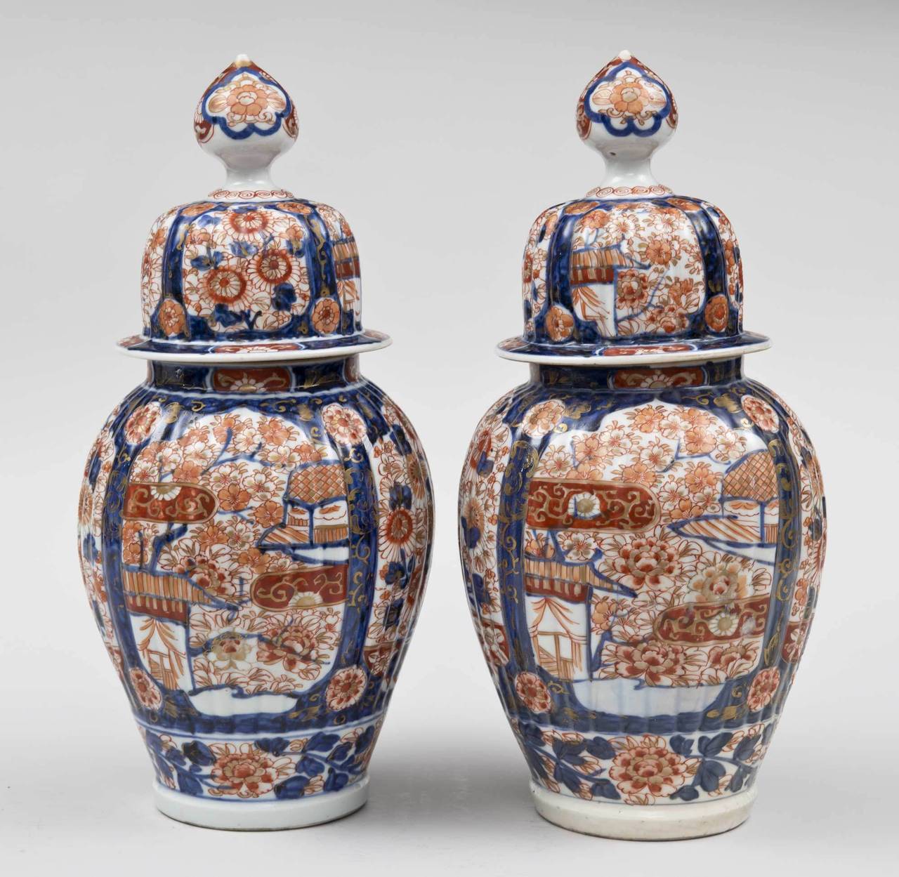 Meiji Pair of Imari Ribbed Vases and Covers