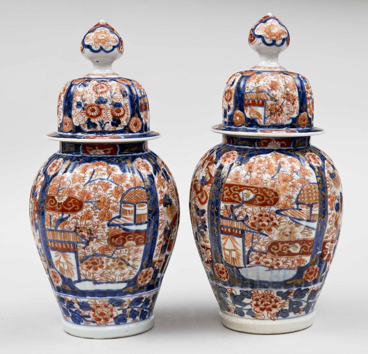 Polychromed Pair of Imari Ribbed Vases and Covers