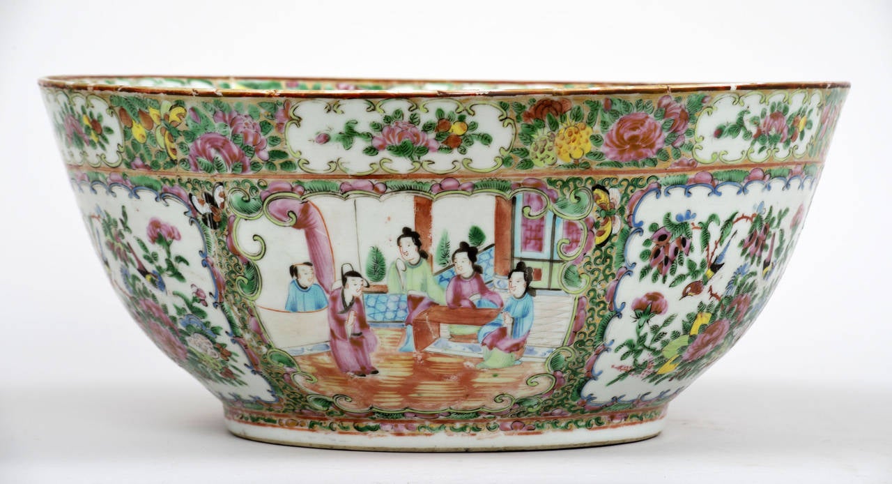 Chinese porcelain rose medallion punch bowl, the interior and exterior each decorated with three figure and three floral, bird and butterfly panels, beneath gold-ground borders.

Item #7393.