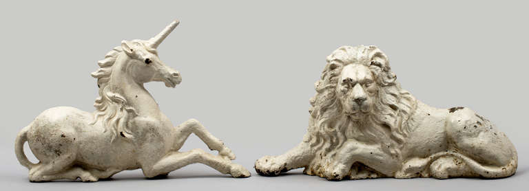 Large cast iron figures of the lion and unicorn, painted white.  They are symbols of the United Kingdom and appear in the full Royal coat of arms of the United Kingdom.  The lion stands for England and the unicorn for Scotland. The combination dates