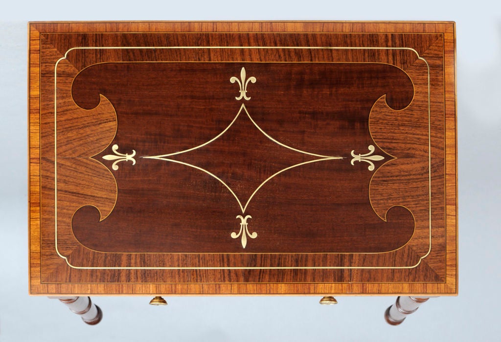 Regency mahogany single drawer free-standing side table cross-banded with three rows of rosewood and inlaid with brass stringing in a swagged diamond shape with brass fleur-de-lis at each point, satinwood and ebony stringing, fitted drawer with