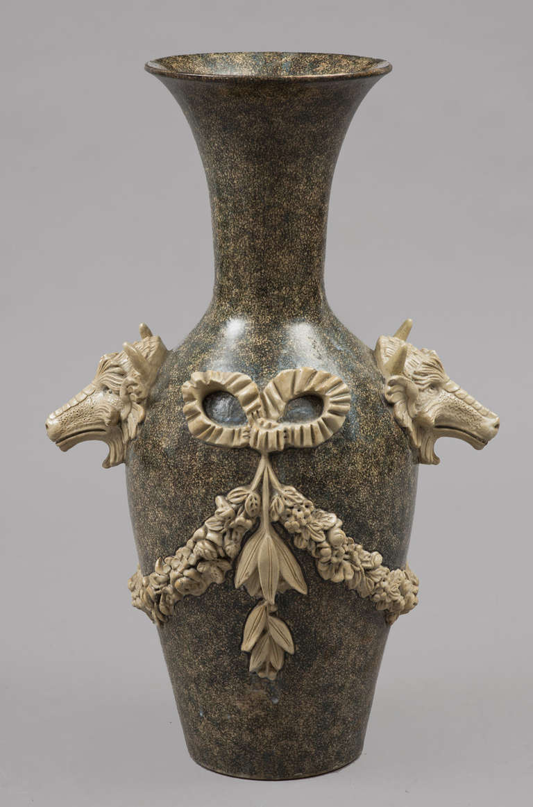 Incredible large stoneware glazed vase with sponge decoration,  salt-glazed applied ornaments of handles in the form of mythical beasts, bow and ribbon swags of floral designs, unmarked but made by the Lipscombe pottery company, London &