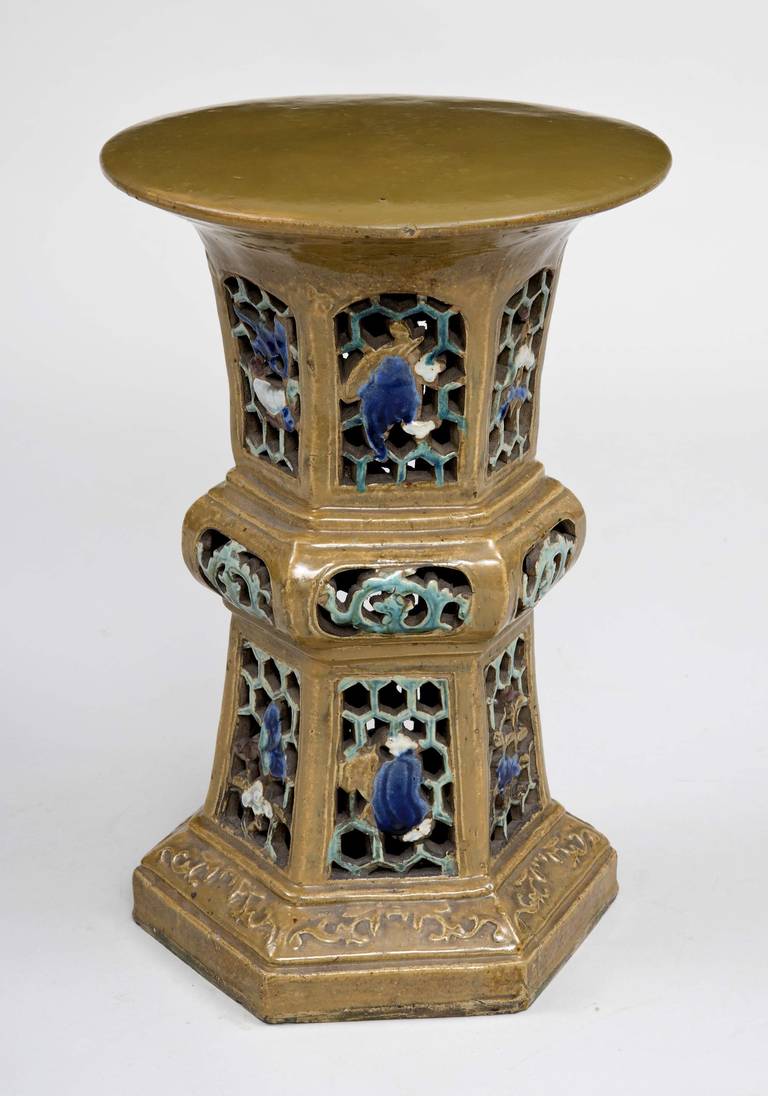 Chinese stoneware garden seat from Shiwan with pierced sides, decorated in olive green, cobalt blue, white and pale turquoise.

 Chinese, circa 1880.
 Height: 20