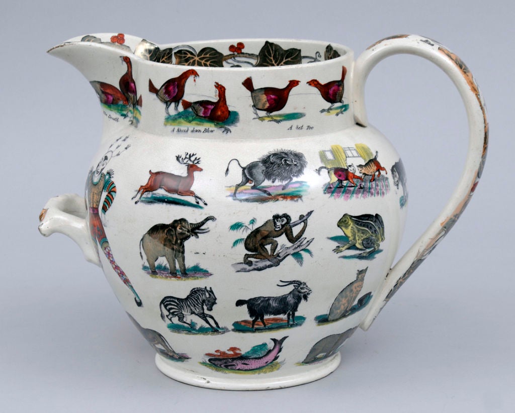 Huge Elsmore and Forster earthenware transfer printed and hand-colored jug with a second carrying handle, featuring the figure of Joe Cashmore, a well-known circus clown of his day,who specialized in acrobatics and stilt walking. The animals on the