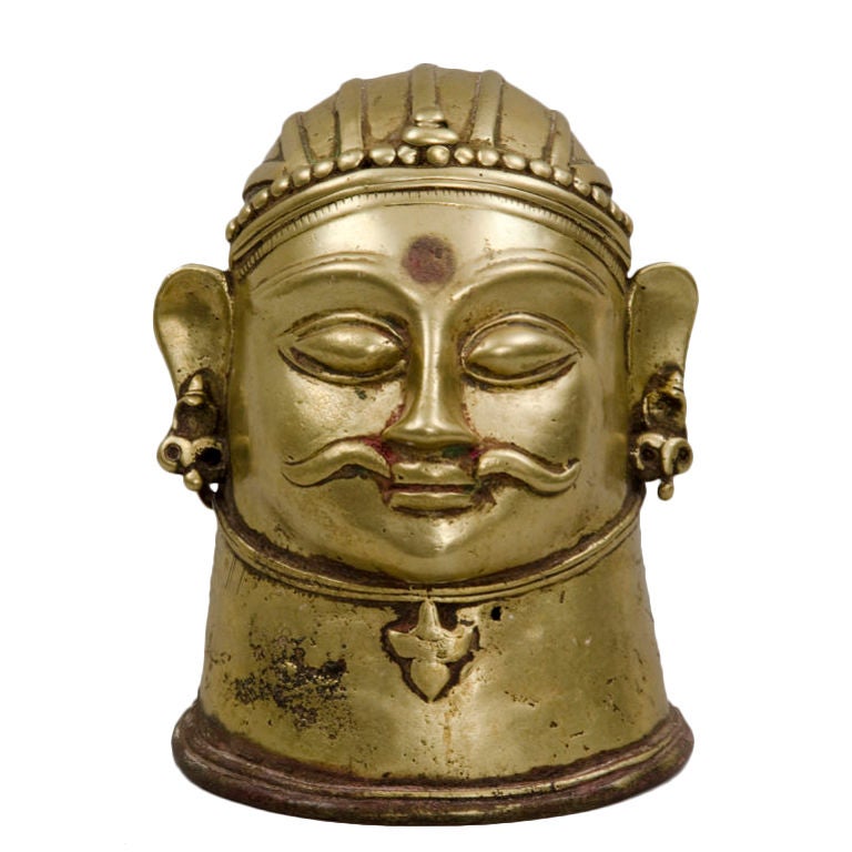 Mukha heavy brass Lingam cover.  Lingam is a symbol of the Hindu deity Shiva, used for worship in temples. Scholars say the Lingam is a representation of male creative energy.  To practicing Hindus the Lingam is a symbol of male and female and the